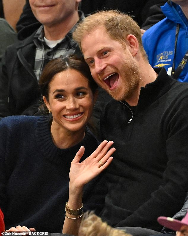 Meghan and Prince Harry smile and wave during the wheelchair basketball event yesterday