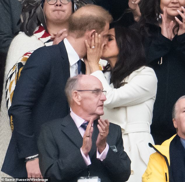 The couple could not keep their hands off each other at the opening ceremony of the contest for injured veterans in Vancouver, Canada