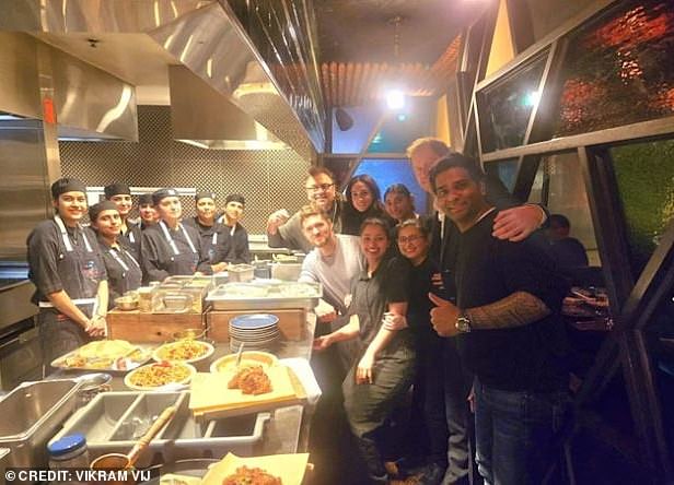 Prince Harry, Meghan and Canadian singer Michael Buble happily posed for photos with kitchen staff (pictured) after tucking into a meal at Indian restaurant Vij's in Vancouver