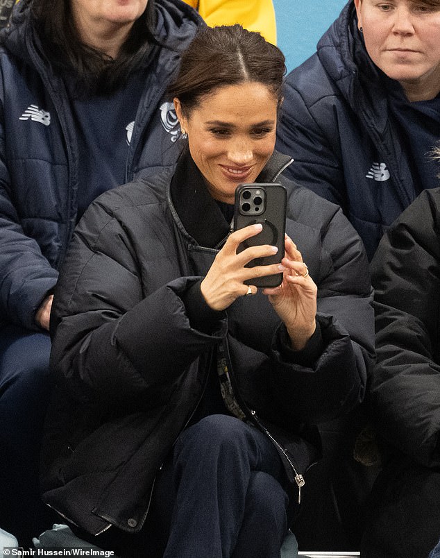 Photos from the Wheelchair Curling and Wheelchair Basketball tournaments showed Meghan seated in the stands while fervently recording the events