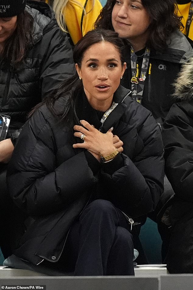 For her final outfit change, Meghan traded in the DOÊN blazer for her black Hermes puffer jacket that she first wore last February during a multi-day trip to Whistler, Canada, to mark the one-year countdown to the 2025 Invictus Games