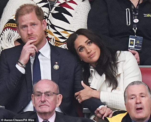 The Duchess of Sussex seemed keen to prove that she was an adoring - and adored wife - with their appearance packed with PDAs