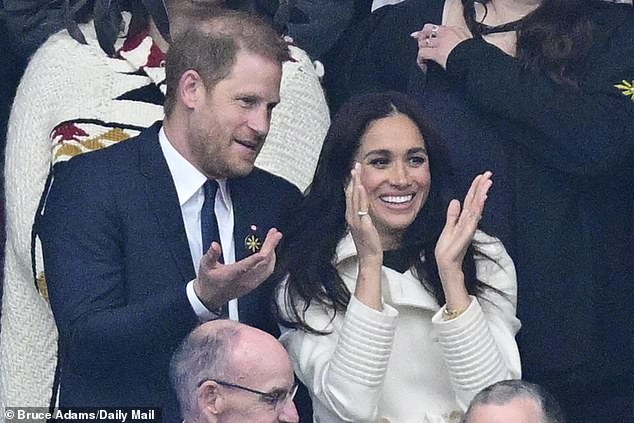 The couple smile at the ceremony of the Games they first went public with their romance at the  2017 Invictus Games