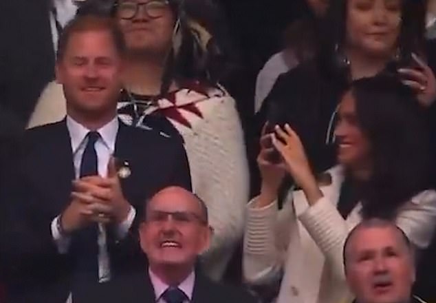 Inbetween touching moments including Meghan planting a kiss on Harry and cheering on with a pair of blue pom-poms, Meghan also made sure to capture the games