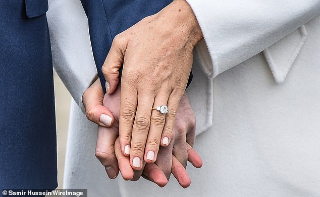 Prince Harry proposed to Meghan in 2017 with a cushion-cut diamond, estimated to be between 2.5 and 3 carats, that he had sourced from Botswana - where the couple took their first holiday together (pictured in November, 2017)