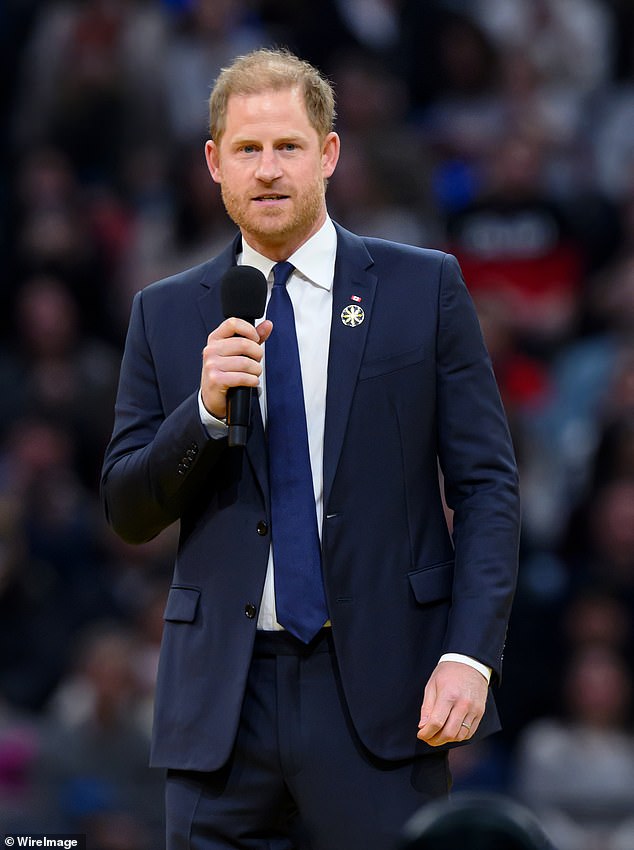 Prince Harry took to the stage to speak of his 'sacred obligation' to do everything he can to help military veterans like himself as he was given a hero's welcome at the opening ceremony of the Invictus Games