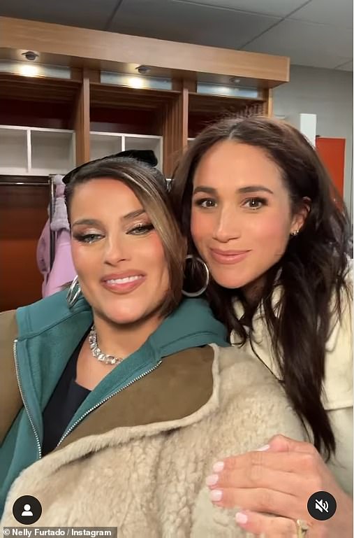 Later in the day Meghan posed with singer Nelly Furtardo (left) backstage for a sweet Instagram video where she showed off her pinky signet ring