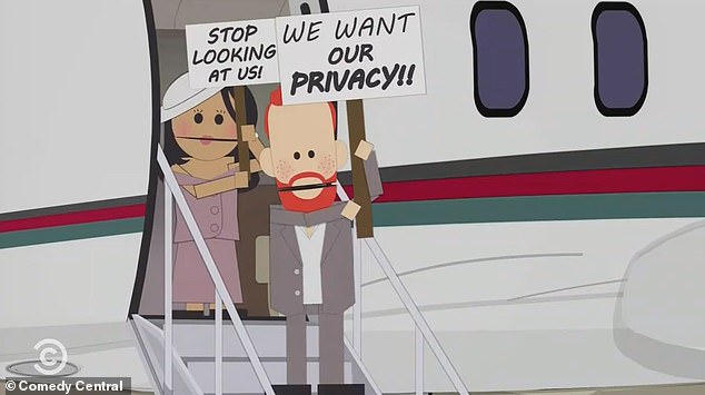 The couple board their private jet, holding their placards