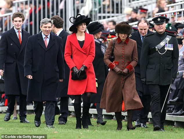 Kate Middleton arrives at the passing-out parade at Sandhurst with her parents, Michael (left) and Carole (right)