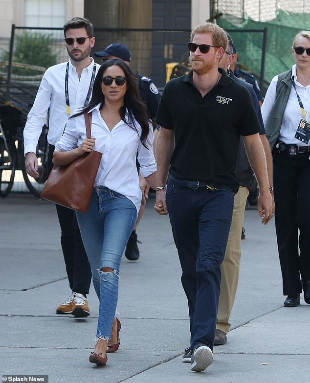 Jason Knauf (left) is pictured with Harry and Meghan attending the Invictus Games in Toronto