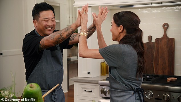 A common theme of romance, love and joy also featured throughout the two trailers. Pictured, Meghan high-fiving one of her guests