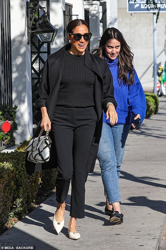 The Duchess has showcased her black Max Mara 'Lilia' cashmere coat on three occasions since December 2022