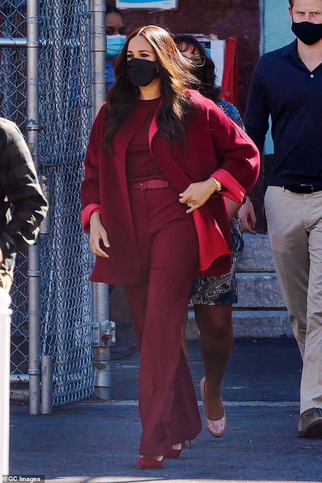 For a visit to Harlem, New York, in September 2021, Meghan embraced tonal dressing in Loro Piana's 'Loreen' cashmere cape and matching 'Antoine' trousers