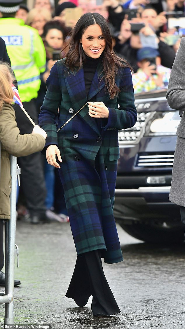 For her first official visit to Scotland with Harry in February 2018, Meghan sported a tartan coat from Burberry