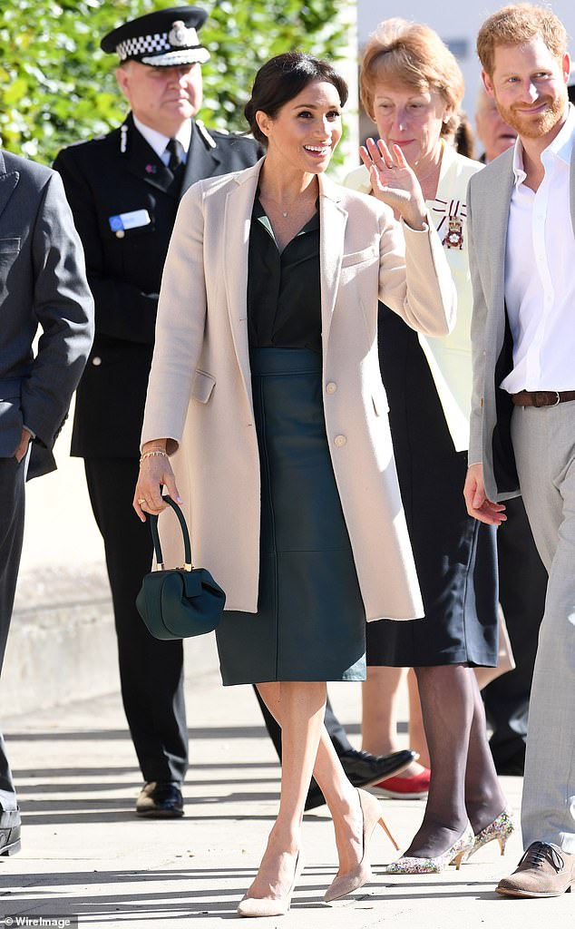 Visiting Sussex for the first time as the Duchess of Sussex, Meghan donned a cashmere coat by Emporio Armani