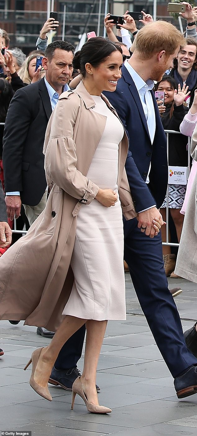 Meghan has worn her Burberry 'Maythorne' silk trench coat on three occasions in 2017, 2018 (pictured) and 2023