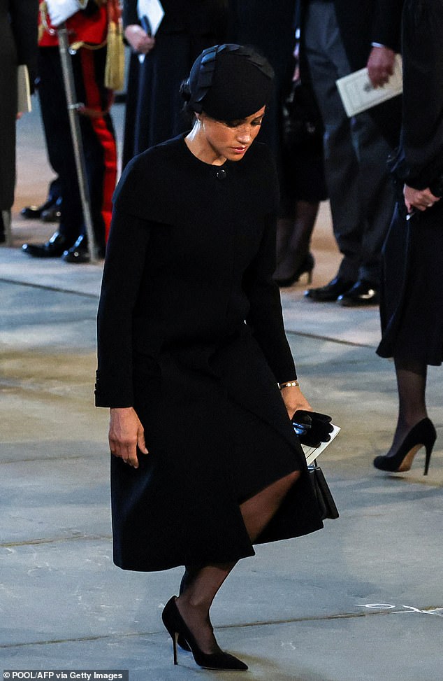 Meghan introduced her custom Givenchy capelet coat at the 2018 Remembrance Sunday Service and most recently wore it to Queen Elizabeth's lying-in-state in September 2022