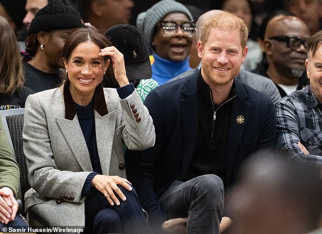 The Duchess with Prince Harry at a wheelchair basketball match between the USA and Nigeria as part of the event