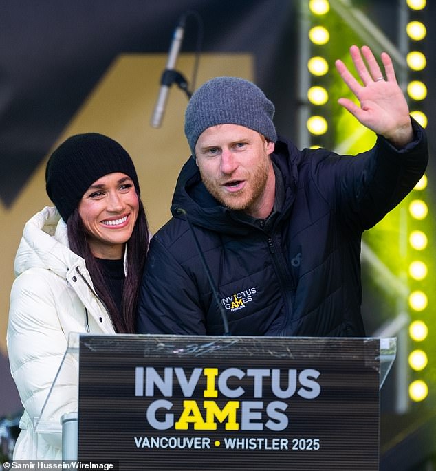 Wearing a white puffer coat to stave off the winter chill, Meghan Markle clings to Prince Harry at the Whistler Welcoming Ceremony during the 2025 Invictus Games