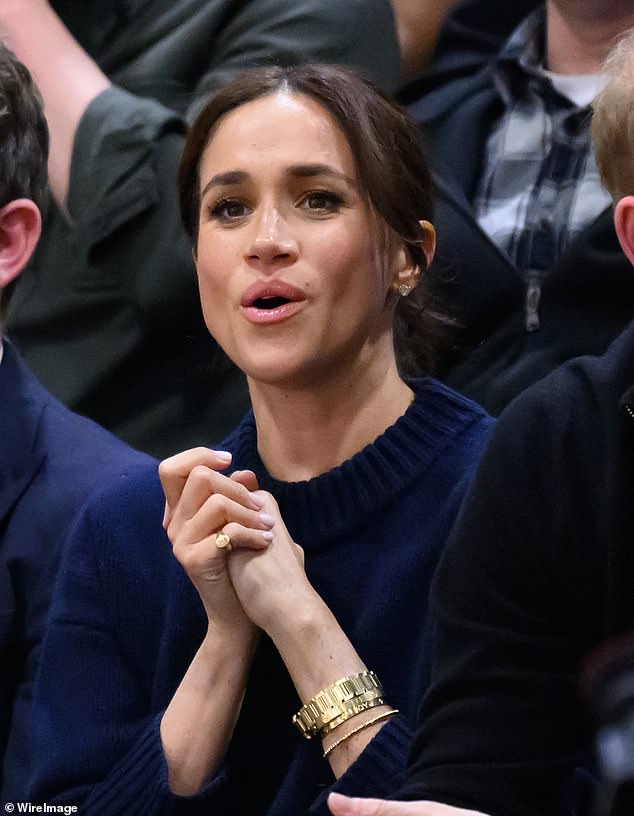 Meghan's signet ring seems to have the Harry and Meghan's insignia from their Sussex Royal days