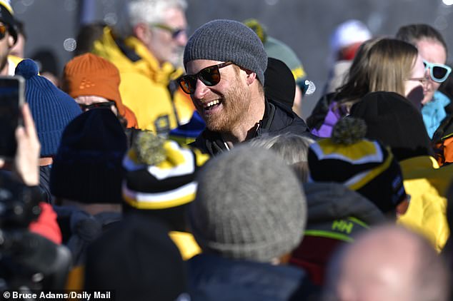 Prince Harry proved he does not need Meghan to pull a crowd of fans as he was mobbed when he arrived for an Invictus Games ceremony on Whistler mountain