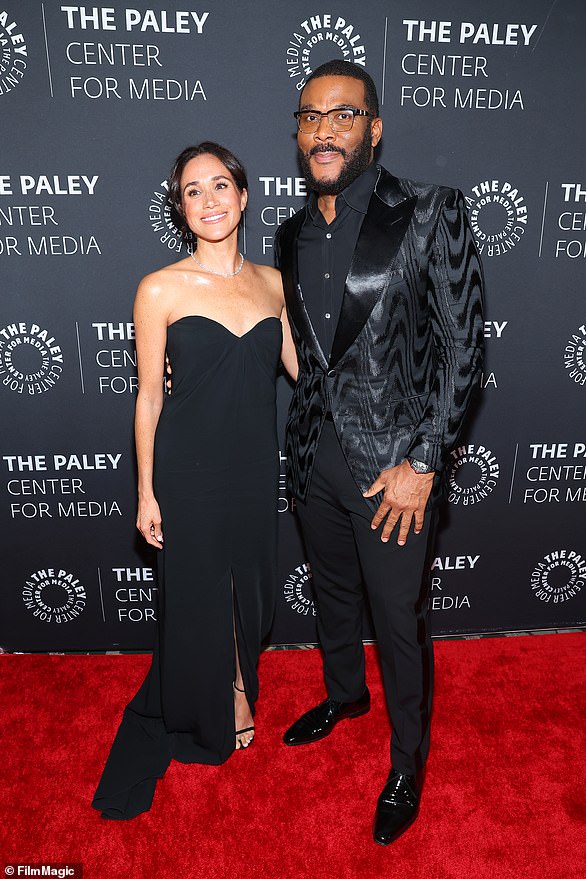 Meghan put on a dazzling display in an elegant black evening gown and $20,000 (£15,722) worth of accessories at the red carpet event in honour of her friend Tyler Perry