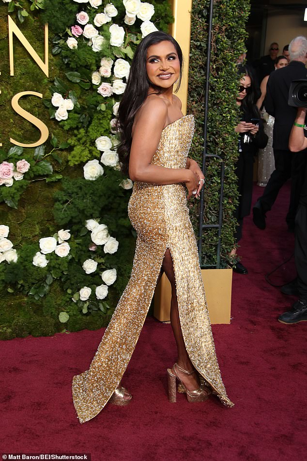 Mindy Kaling showed off her slimline physique on one of Hollywood's biggest nights as she stunned in a gold dress as she strutted her stuff down the red carpet of the Golden Globe Awards 2025 on Sunday