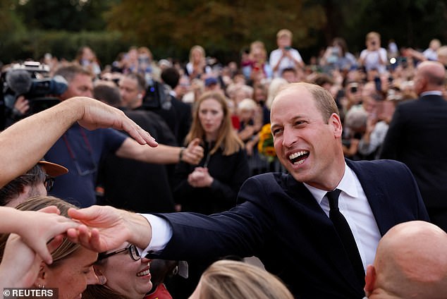 William, Prince of Wales, giving a wide smile to royal fans