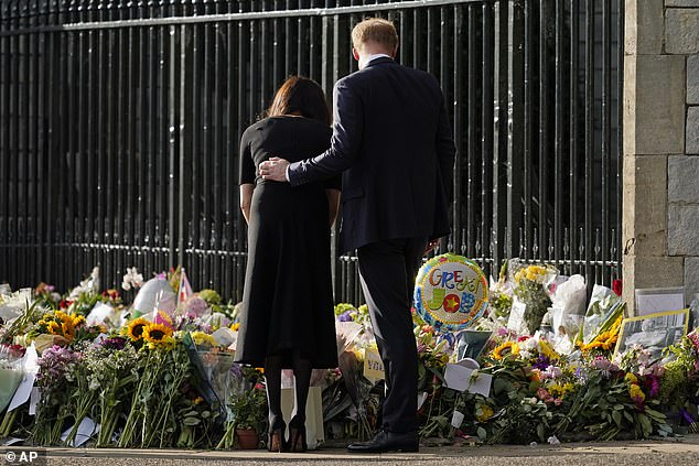 The couple view the floral tributes for the late Queen Elizabeth II outside Windsor Castle