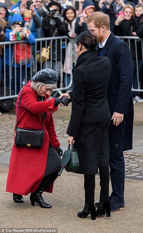 Meghan and Harry were greeted by one woman in Cardiff in the proper formal tradition, with a curtsey