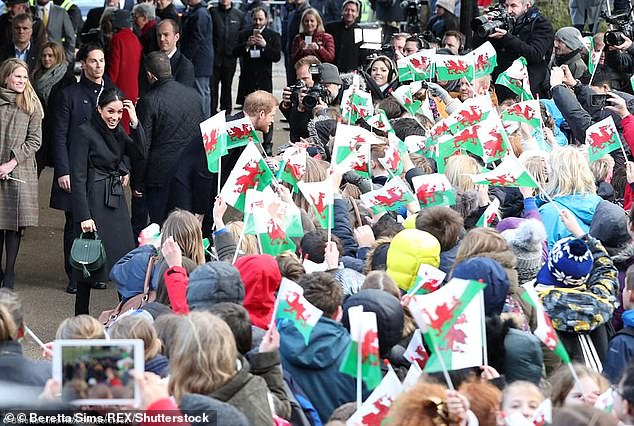 But it appears the rule-breaking got lost in amongst all the Meghan mania. Royal supporters queued outside Cardiff Castle from 6am as they waited in the biting cold for the US-born actress and her besotted prince