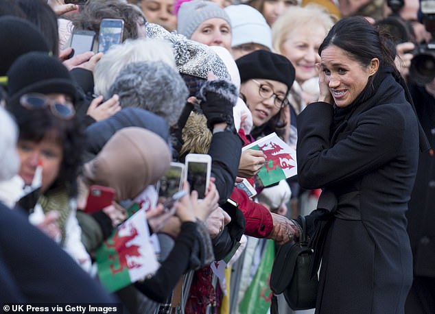 Meghan Markle shaking hands outside Cardiff Castle on January 18, 2018