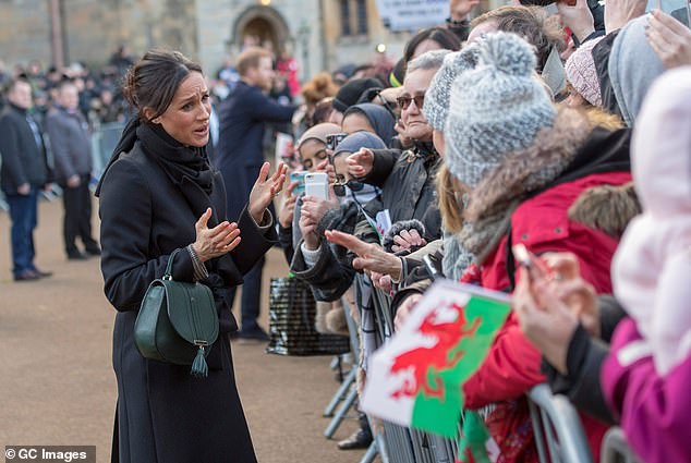 People welcomed Meghan with open arms, handing her gifts when she stopped to say hello