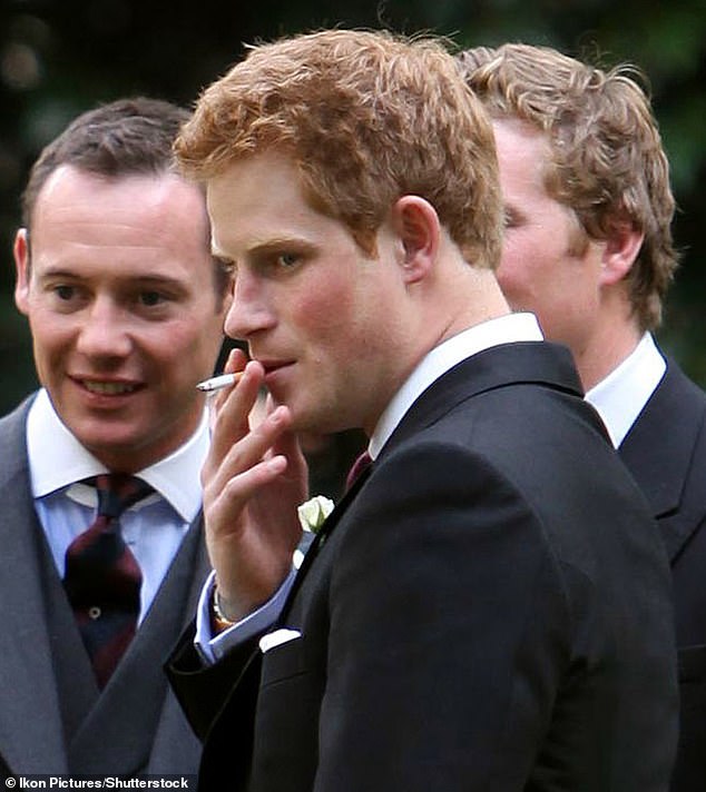 Harry smokes a cigarette at the wedding of Captain Nicholas Van Cutsem and Alice Hadden-Paton in August 14, 2009