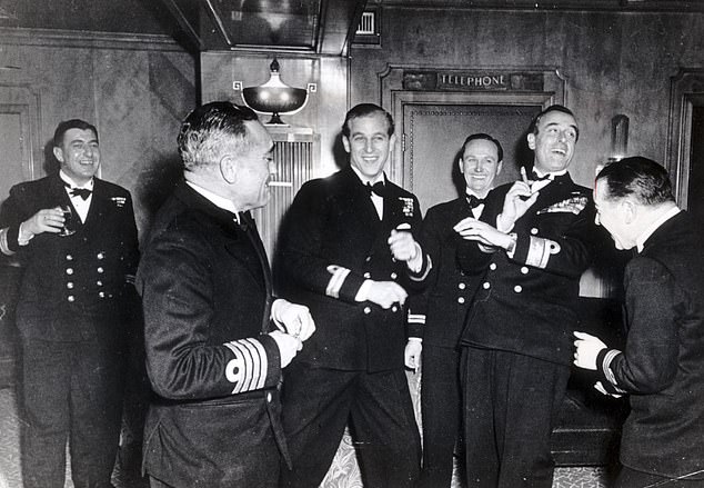 Phillip (centre) enjoys his bachelor party at the Dorchester Hotel in November 1947, with Lord Mountbatten (second from the right) and his private secretary Michael Parker (third from the right)