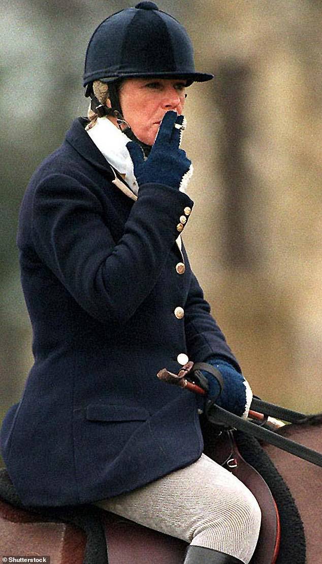 Camilla Parker Bowles rides in the Duke of Beaufort Hunt in 1996 with a cigarette in hand