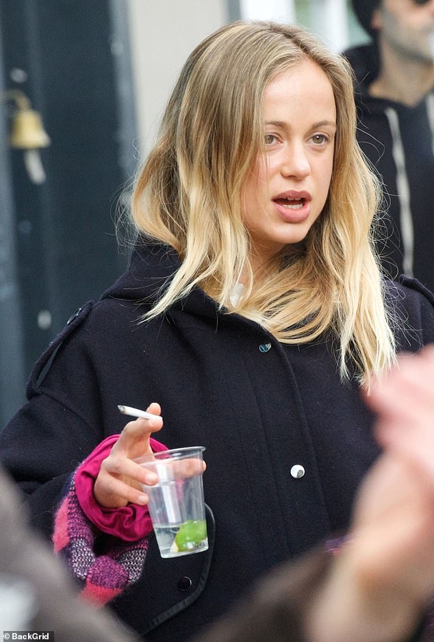 Lady Amelia is pictured with her cousin Cassius Taylor at a trendy pub in Notting Hill