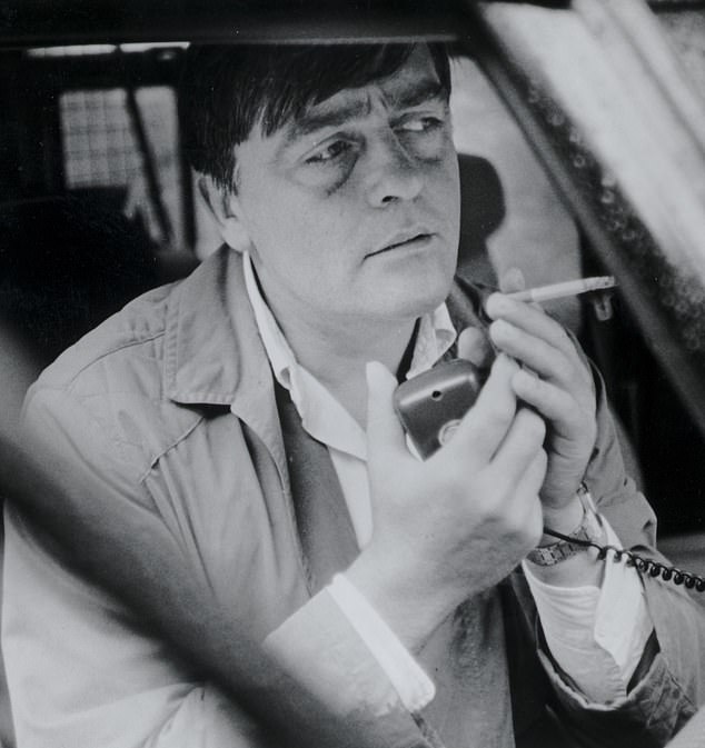 Gerald Cavendish Grosvenor, the 6th Duke of Westminster, smokes a cigarette in his car