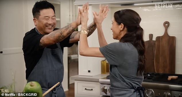 In one clip of 'With Love, Meghan', the Duchess of Sussex is shown prepping vegetables with chef Roy Choi before the pair high-five one another