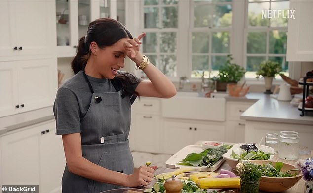 Meghan wipes her brow as she cooks on her new Netflix show 'With Love, Meghan', airing on March 4