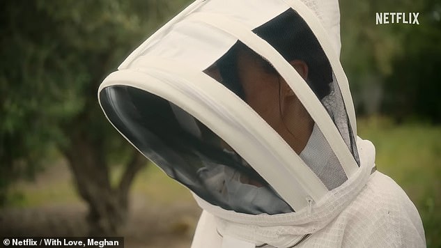 Another clip from the show features Meghan in a full beekeepers' outfit as she gathers honey