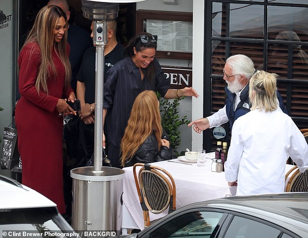 Meghan appeared delighted to catch up with friends including the restaurant's owners