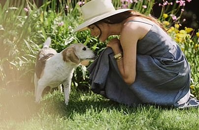 Meghan opened up in the article about her family life. She is pictured with the Sussexes' beloved beagle, Gus