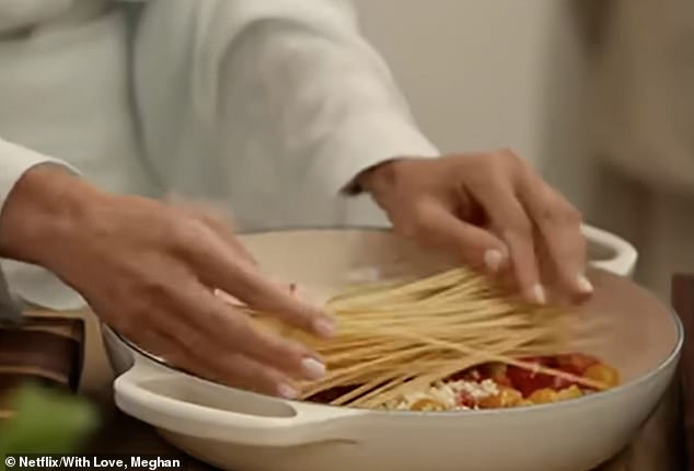 Meghan, who at one point during the cooking calls spaghetti 'noodles', preps the dish, a family favourite, on the £15,000 cooker in the reality TV house where her new eight-parter was filmed