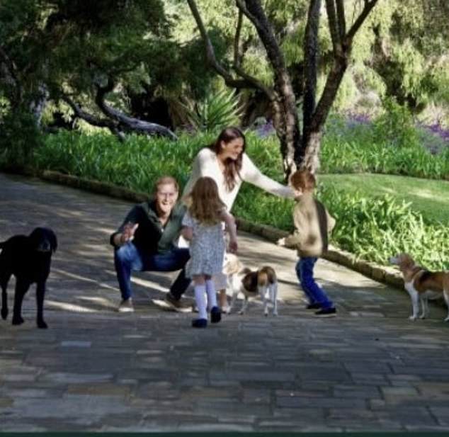 The Sussexes are pictured together in a family picture. Meghan talks about Archie and Lilibet on a number of occasions