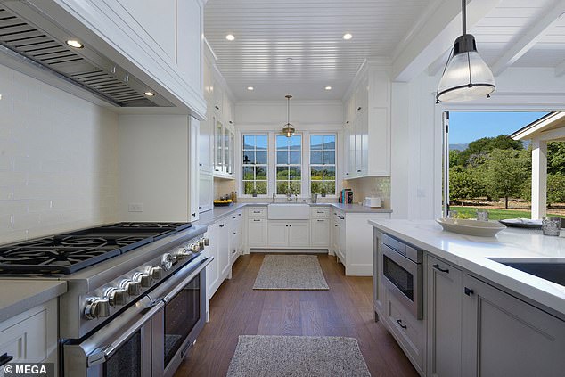 However, the bright, farm-style kitchen with white cabinetry and a sprawling outdoor space isn't actually hers - it's an $8 million property a few miles from her own in Montecito, California