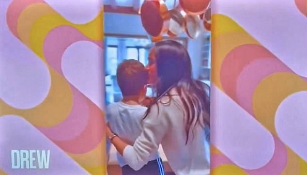 Meghan tenderly kisses Archie on the head while baking for the crew and audience on Drew Barrymore's show