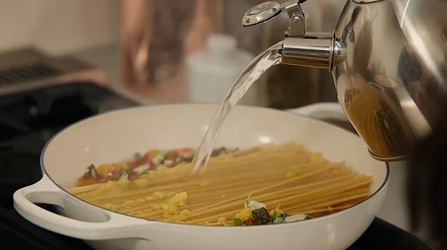 Meghan puts all the ingredients in the pan and cooks it with boiling water