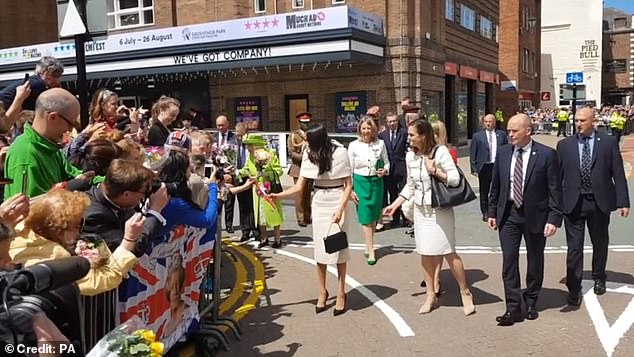 Resurfaced footage from the event shows the newly-made Duchess boldly striding in front of the then 92-year-old monarch and grabbing a bouquet of flowers while aides stand nearby