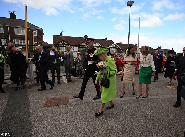 In other photos taken from the day, Meghan remained in her correct position behind the Queen